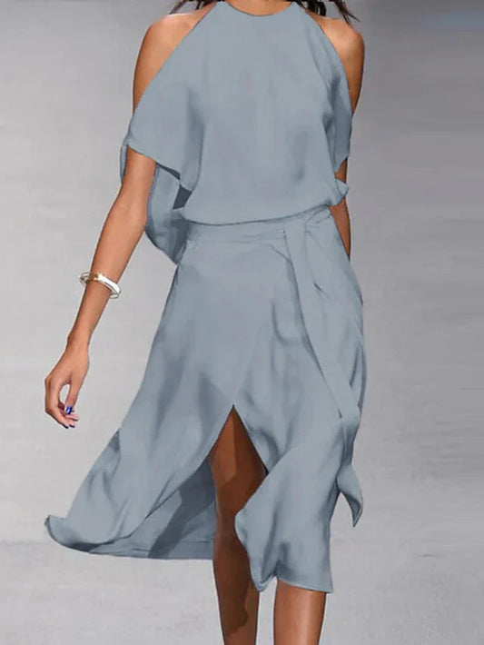 Asymmetrische midi-jurk met blote schouders en elegante beweging