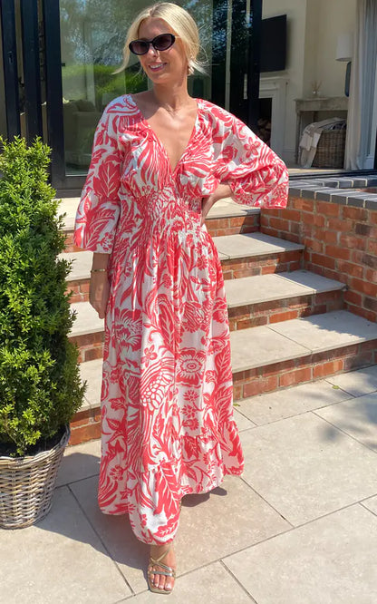 Lange jurk met V-hals en bloemenprint in blauw en wit