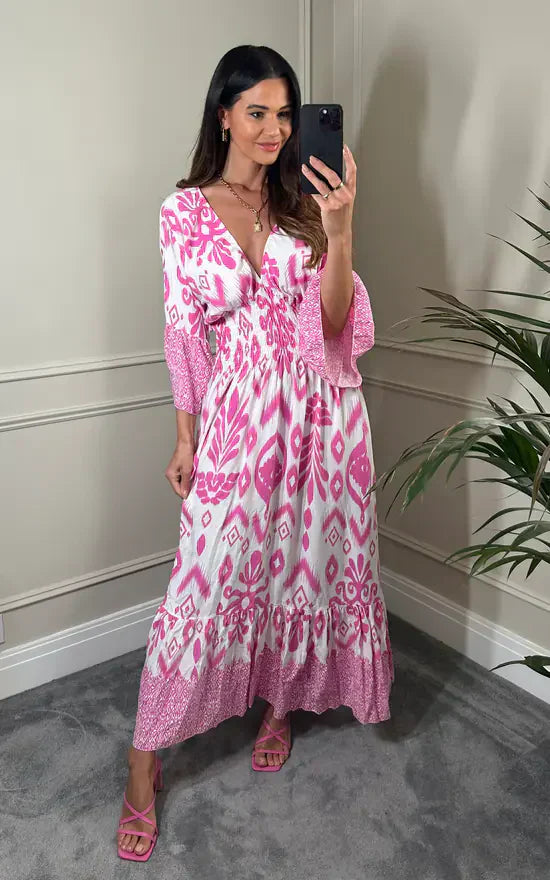Lange jurk met V-hals en bloemenprint in blauw en wit