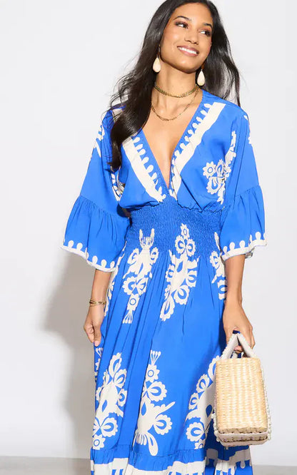 Lange jurk met V-hals en bloemenprint in blauw en wit
