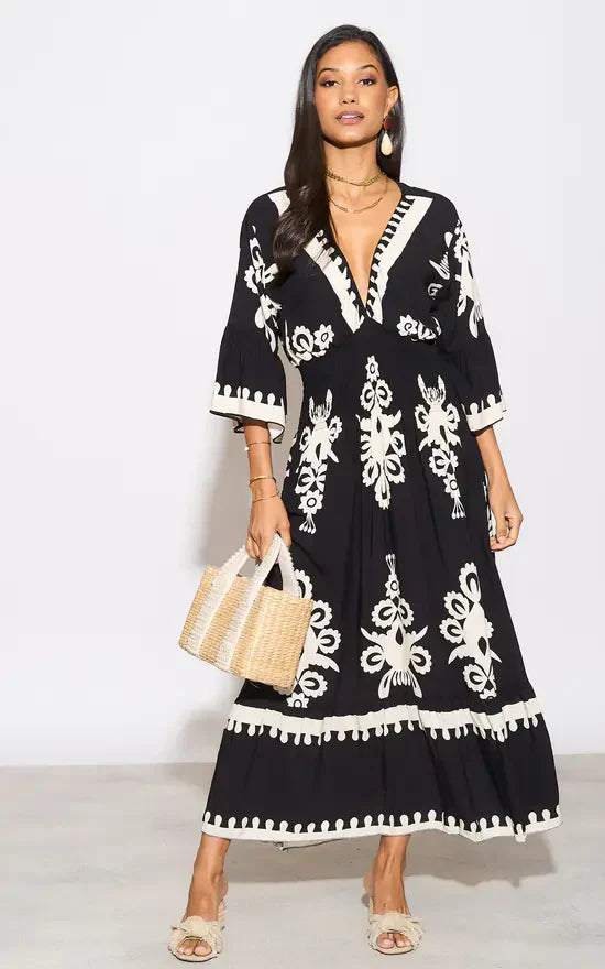 Lange jurk met V-hals en bloemenprint in blauw en wit
