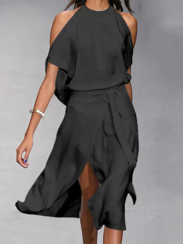 Asymmetrische midi-jurk met blote schouders en elegante beweging