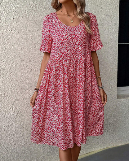 Elegante korte jurk met korte mouwen en subtiele bloemenprint
