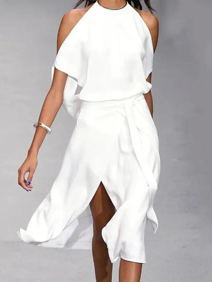 Asymmetrische midi-jurk met blote schouders en elegante beweging