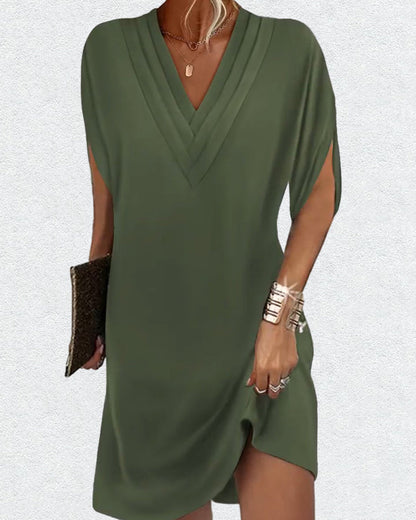 Elegante jurk met open mouwen en V-halslijn