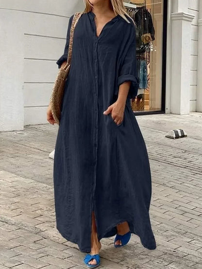 Losse, casual, effen pocketjurk met een rij knopen en lange mouwen