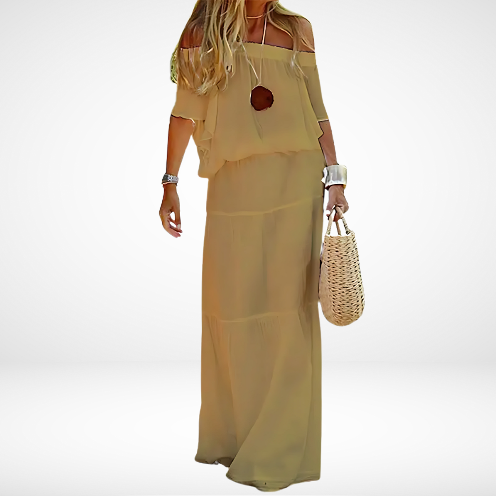 Elegante witte maxi-jurk voor op de schouders voor op het strand