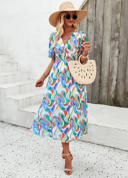 Elegante lange jurk met V-hals en subtiele print