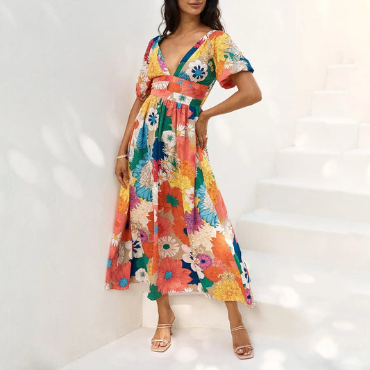 Lange jurk met bloemenprint en korte pofmouwtjes