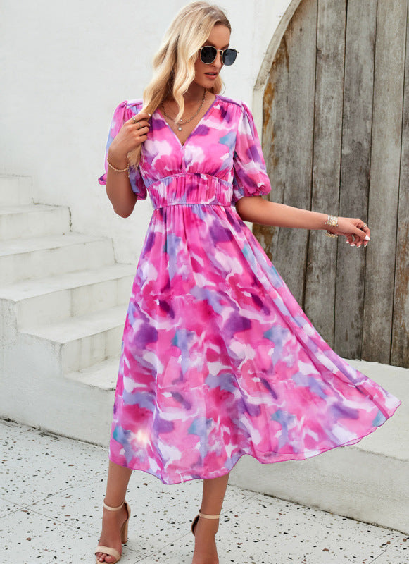 Elegante lange jurk met V-hals en subtiele print