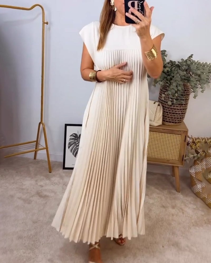 Casual midi-jurk met geplooid patroon, ideaal voor een moderne en ontspannen look.