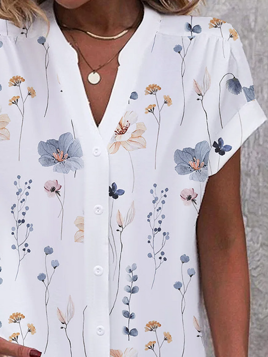 Linda - Losse, casual blouse met bloemen en knopen