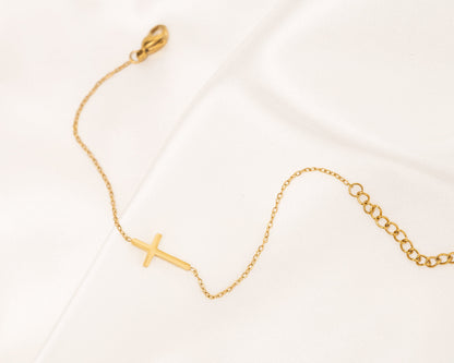 Gouden en zilveren kruis armband
