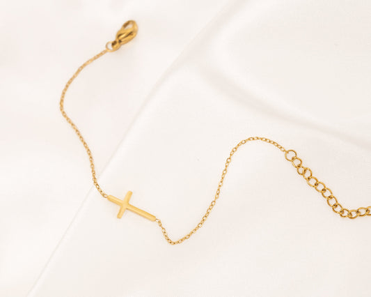 Gouden en zilveren kruis armband