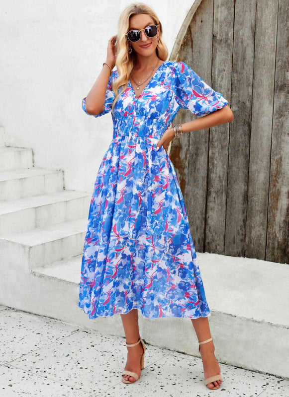 Elegante lange jurk met V-hals en subtiele print