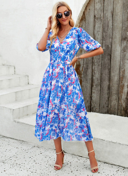 Elegante lange jurk met V-hals en subtiele print