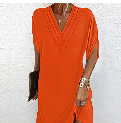 Elegante jurk met open mouwen en V-halslijn