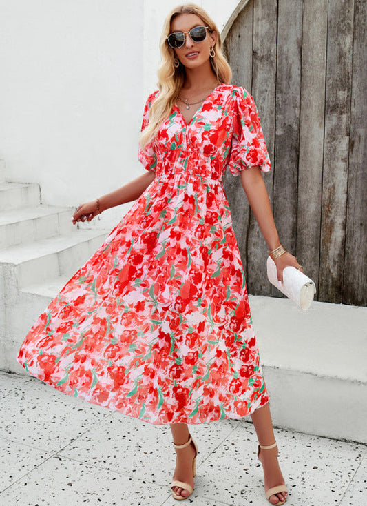 Elegante lange jurk met V-hals en subtiele print