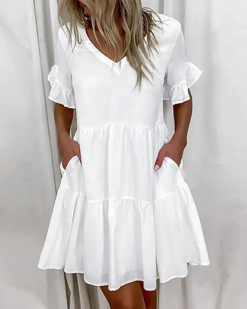 Eenvoudige casual jurk met V-hals en zoom met ruches